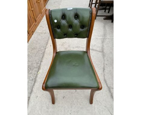 A GREEN LEATHER AND MAHOGANY BUTTON BACK STUDY CHAIR 