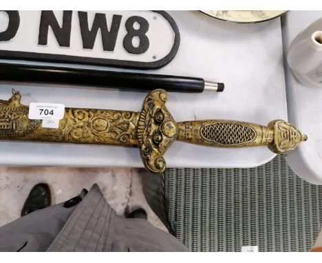 A HIGHLY ORNATE AND DECORATIVE ORIENTAL SWORD AND SCABBARD 