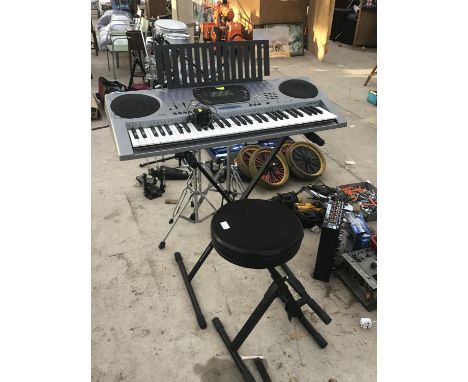A CASIO KEYBOARD WITH STOOL IN WORKING ORDER 