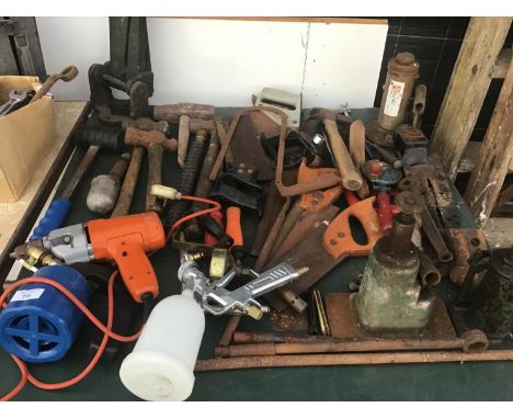 A LARGE COLLECTION OF TOOLS TO INCLUDE SAWS, MALLETS, JACKS ETC 
