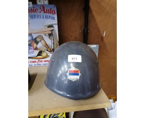 A VINTAGE METAL ARMY HELMET WITH SERBIAN FLAG 