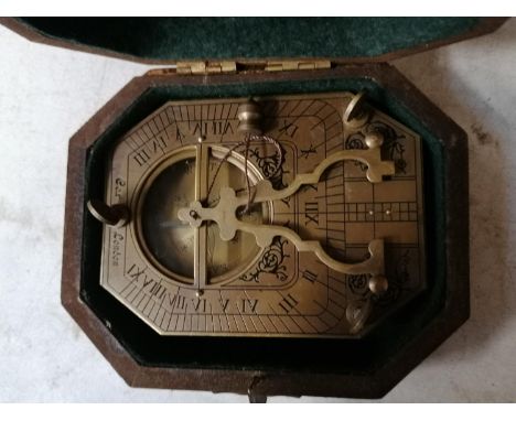 A CASED BRASS SUNDIAL COMPASS, COX OF LONDON 