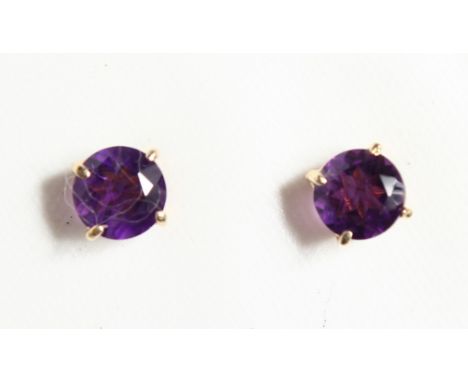 A PAIR OF 9CT GOLD AND AMETHYST STUDS.