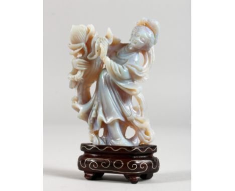 AN UNUSUAL CHINESE CARVED OPAL FIGURE OF A LADY ON A STAND. Figure 2.5ins high.