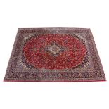 A GOOD LARGE KASHAN CARPET, 20TH CENTURY, claret ground with allover floral decoration. 13ft 0ins
