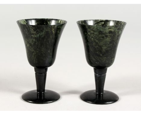 A SMALL PAIR OF JADE WINE CUPS. 3ins high.