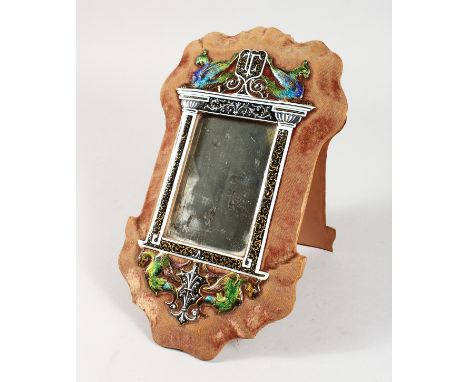 A CHAMPLEVE ENAMEL MIRROR on a velvet background. 11ins long.