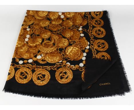 A VINTAGE CHANEL SILK SCARF, BLUE WITH GOLD CHANEL EMBLEM.