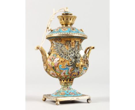 A MINIATURE RUSSIAN SILVER AND ENAMEL SAMOVA. Marks not clear. 3.5ins high.