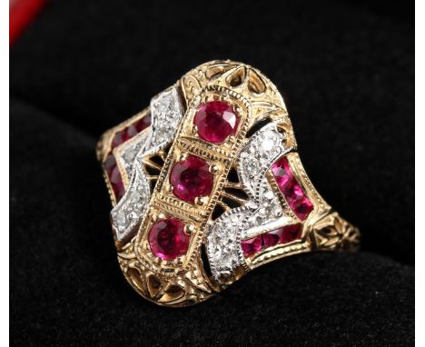 A 9CT GOLD, DIAMOND AND RUBY RING.
