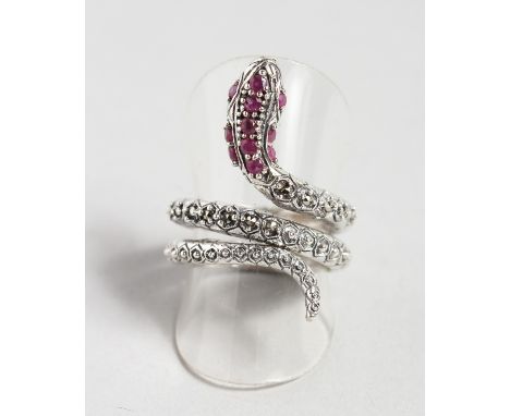 A SILVER, RUBY AND MARCASITE SNAKE RING.