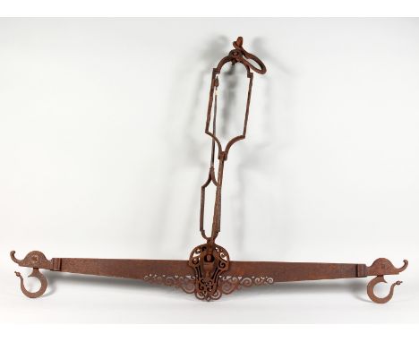AN EARLY SPANISH WROUGHT IRON SET OF HANGING SCALES. 46ins wide x 36ins high.