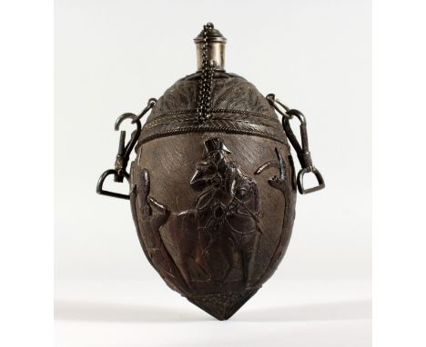 A SUPERB 1800 CARVED COLONIAL COCONUT BOTTLE lavishly carved in relief with Napoleon on horse back, a soldier saluting, the o
