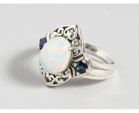 A SILVER SAPPHIRE AND GILSON OPAL RING.