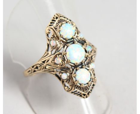 A 9CT GOLD AND GILSON OPAL RING.