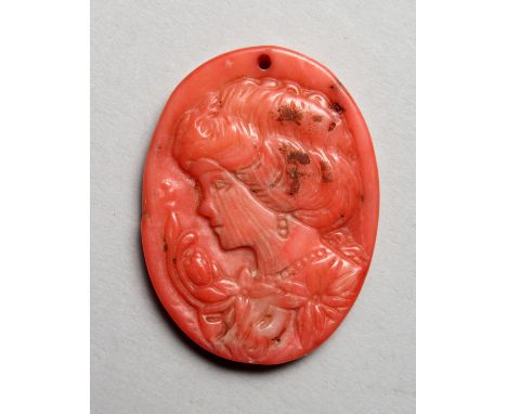 A SMALL RELIEF CARVED CORAL CAMEO PORTRAIT BUST OF A LADY. 1.5ins high.