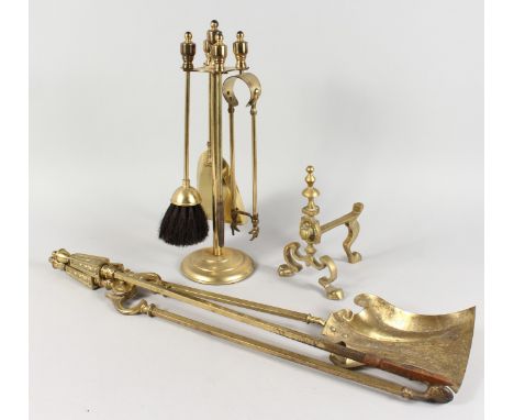 A BRASS FIRESIDE COMPANION SET ON STAND, set of three fireside tools, and a fire dog.
