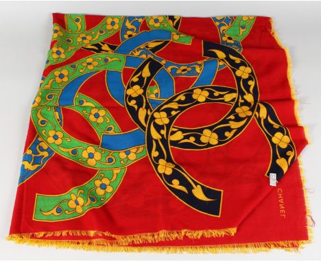 A VINTAGE CHANEL SILK SCARF, RED AND BLUE WITH FLOWER HEADS.