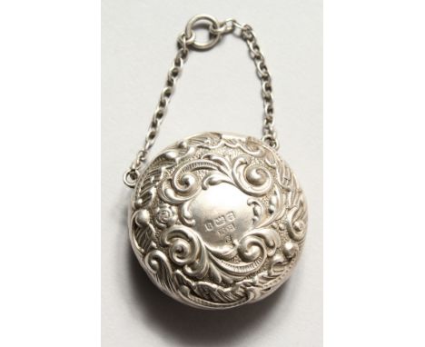 A CIRCULAR SILVER PATCH BOX on a chain, the lid with a mirror. Birmingham 1901. Maker H. M.