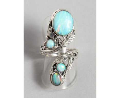 A SILVER NATURALISTIC SET REAL OPAL RING.