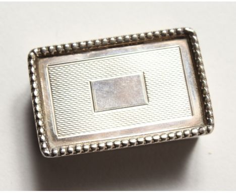 A REEDED AND ENGINE TURNED SNUFF BOX. Birmingham 1968.