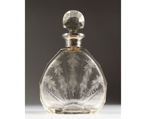 A FINELY ENGRAVED DECANTER AND STOPPER with silver band.