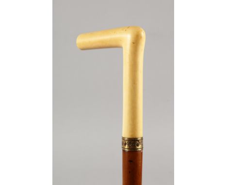 A VICTORIAN MALACCA WALKING STICK with ivory handle and lip. 32ins long.