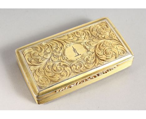 A VICTORIAN SILVER GILT SNUFF BOX engraved with scrolls, with crest. Birmingham 1840. Maker F. C. 3ins long.