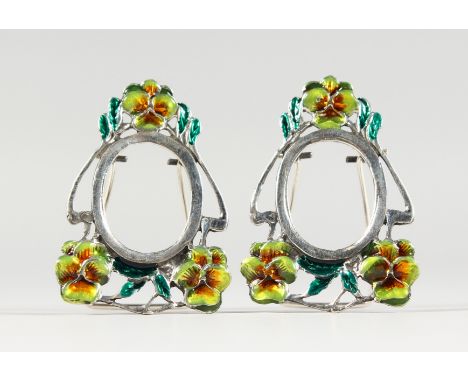 A PAIR OF MINIATURE ART NOUVEAU STYLE SILVER AND ENAMEL PHOTOGRAPH FRAMES. 1.75ins high.