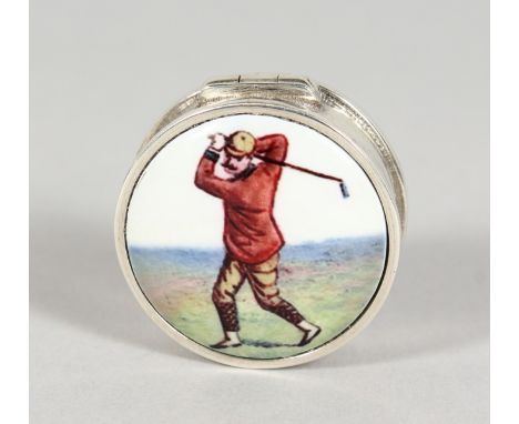 A SILVER CIRCULAR GOLF PILL BOX, with enamel top. 1ins diameter.