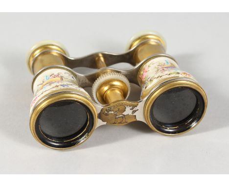 A SUPERB PAIR OF SEVRES PORCELAIN OPERA GLASSES, the background painted with young girls and musical trophies, with mother-of