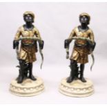 A PAIR OF COLOURFUL BLACKAMOOR STICK STANDS.
