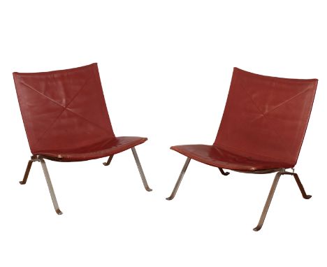 POUL KJAERHOLM FOR E. KOLD CHRISTENSEN: A PAIR OF LOW CHAIRS MODEL PK22 with red leather upholstered back and seat on chrome 