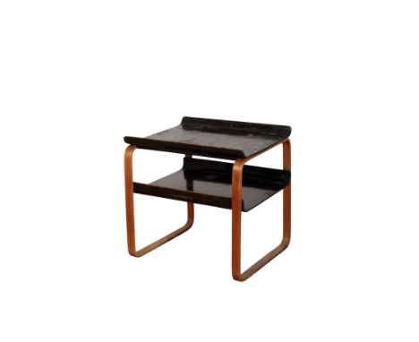 ALVAR AALTO: A TWO-TIER SIDE TABLE model numbers 75/83 and 915, the black lacquer top and undershelf with curved sides, the F