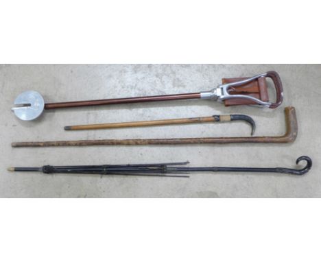 Two walking canes, an umbrella frame and a shooting stick 