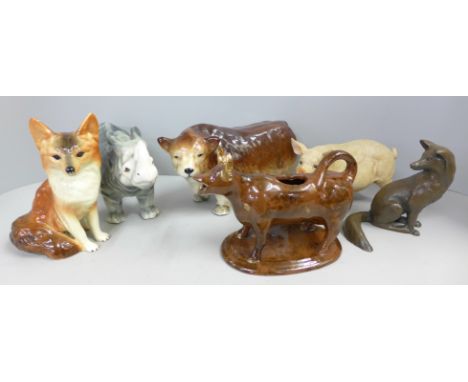 A collection of ceramic animals, a model of a pig and a model of a fox  **PLEASE NOTE THIS LOT IS NOT ELIGIBLE FOR POSTING AN