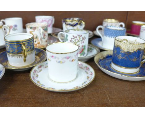 A collection of eighteen early to mid 20th Century coffee cans and saucers, includes Wedgwood, New Chelsea, Anchor, Spode, Ro