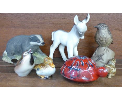 Seven ceramic animal and bird figures; Aynsley badger, Lomonosov donkey, Poole robin, two Goebel birds, Tremor squirrel and a