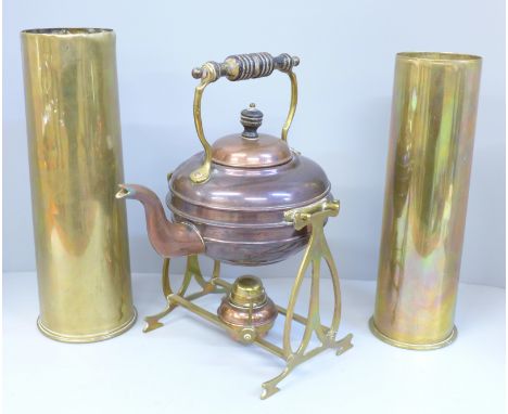 Two WWI brass shells and a copper spirit kettle on a brass stand 
