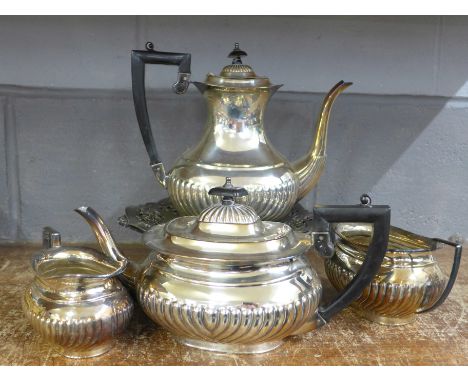 A four piece plated tea service and two plated dishes **PLEASE NOTE THIS LOT IS NOT ELIGIBLE FOR POSTING AND PACKING** 