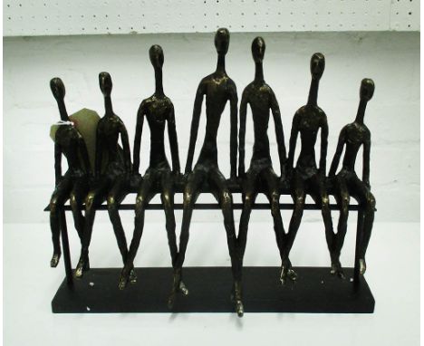 TABLE ORNAMENT, of a family seated on a bench, in bronzed resin, 39cm L.