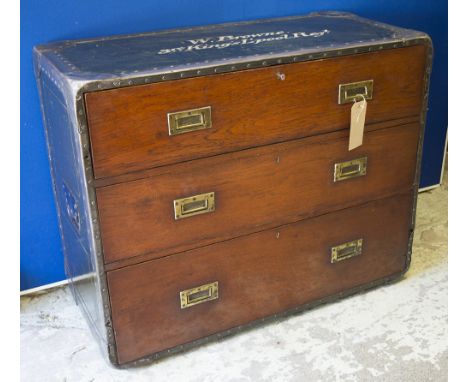  CAMPAIGN CHEST, teak, iron bound and painted, with three long drawers and recessed side carrying handles.inscribed 'W Browne