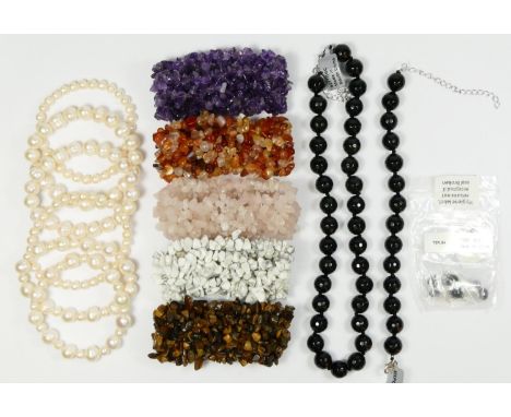 Six freshwater cultured pearl bracelets, 9.5 - 6mm diameter, five pebble gemstone bracelets, and a onyx necklace, bracelet an
