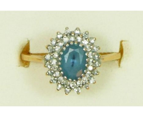 A 9ct gold blue topaz and diamond cluster ring K, 2.2gm 