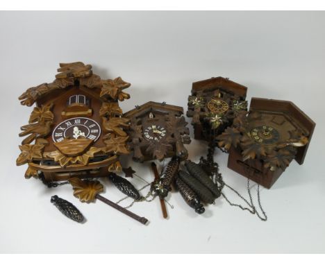 A collection of eight manual wind cuckoo clocks together with a multi coloured quartz example. (8 in the lot)