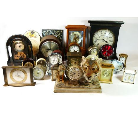 A collection of early 20th century and later mantel clock, manual wind and quartz movements. (3)