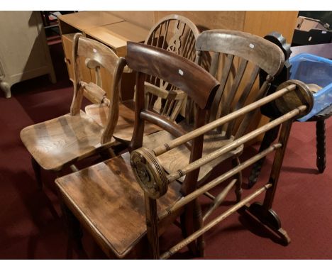 A stripped pine rocking chair, together with three dining chairs, a towel rail.and an early 20th century mahogany framed fire