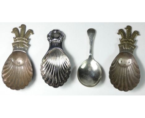 Two Prince of Wales silver gilt and silver caddy spoons, Sheffield 1981, both inscribed and two other caddy spoons, 77 gm 