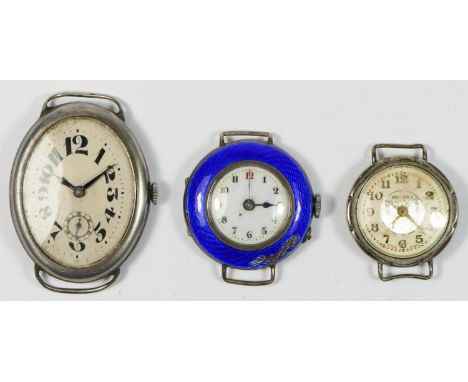 A WWI silver oval manual wind gentleman's wristwatch, London import 1917, 30 x 40mm, and two other silver cased wristwatches,