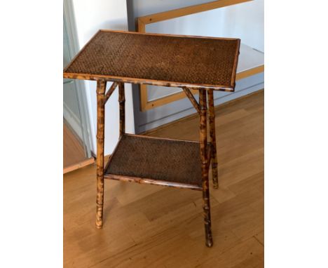 A late 19th Century tiger bamboo side table, two tier with rattan top and lower shelf.68cm tall 